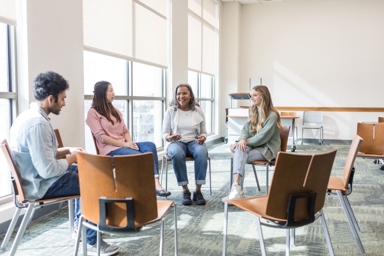 Senior woman leads diverse focus group